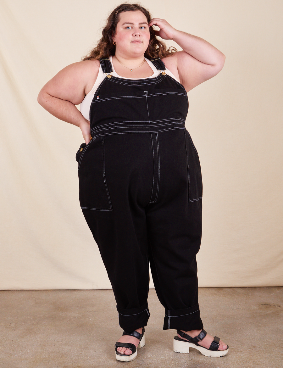 Mara is 5'5" and wearing 4XL Original Overalls in Basic Black