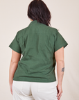 Back view of Pantry Button-Up in Dark Emerald Green worn by Faye
