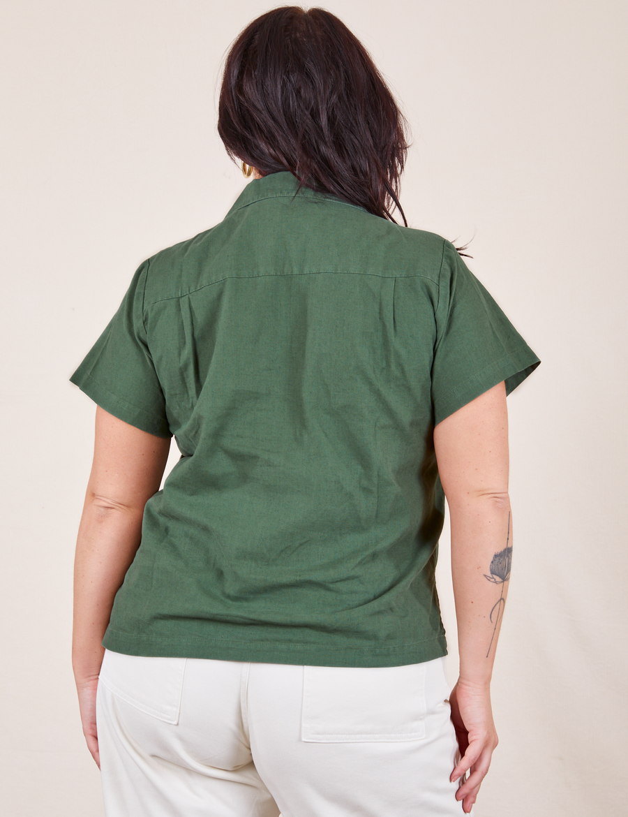 Back view of Pantry Button-Up in Dark Emerald Green worn by Faye