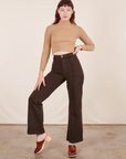 Alex is 5'8" and wearing XS Western Pants in Espresso Brown paired with tan Essential Turtleneck