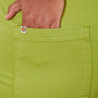 Western Pants in Gross Green hand in back pocket close up