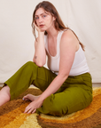 Allison is wearing Work Pants in Olive Green and vintage off-white Tank Top.