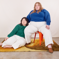 Heavyweight Crew in Hunter Green on Ashley and Catie wearing Royal Blue colorway paired with vintage off-white Western Pants