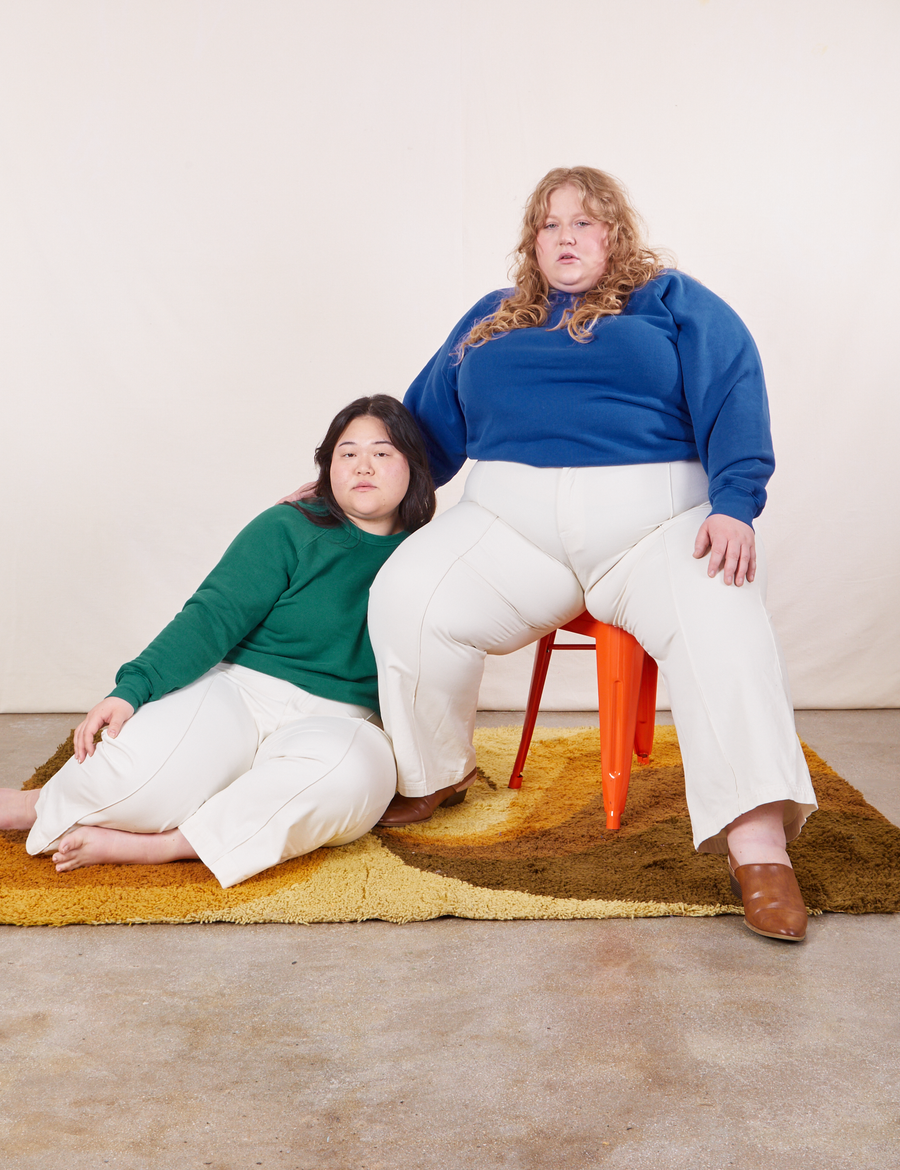 Heavyweight Crew in Hunter Green on Ashley and Catie wearing Royal Blue colorway paired with vintage off-white Western Pants