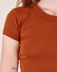 Front close up of Baby Tee in Burnt Terracotta on Alex