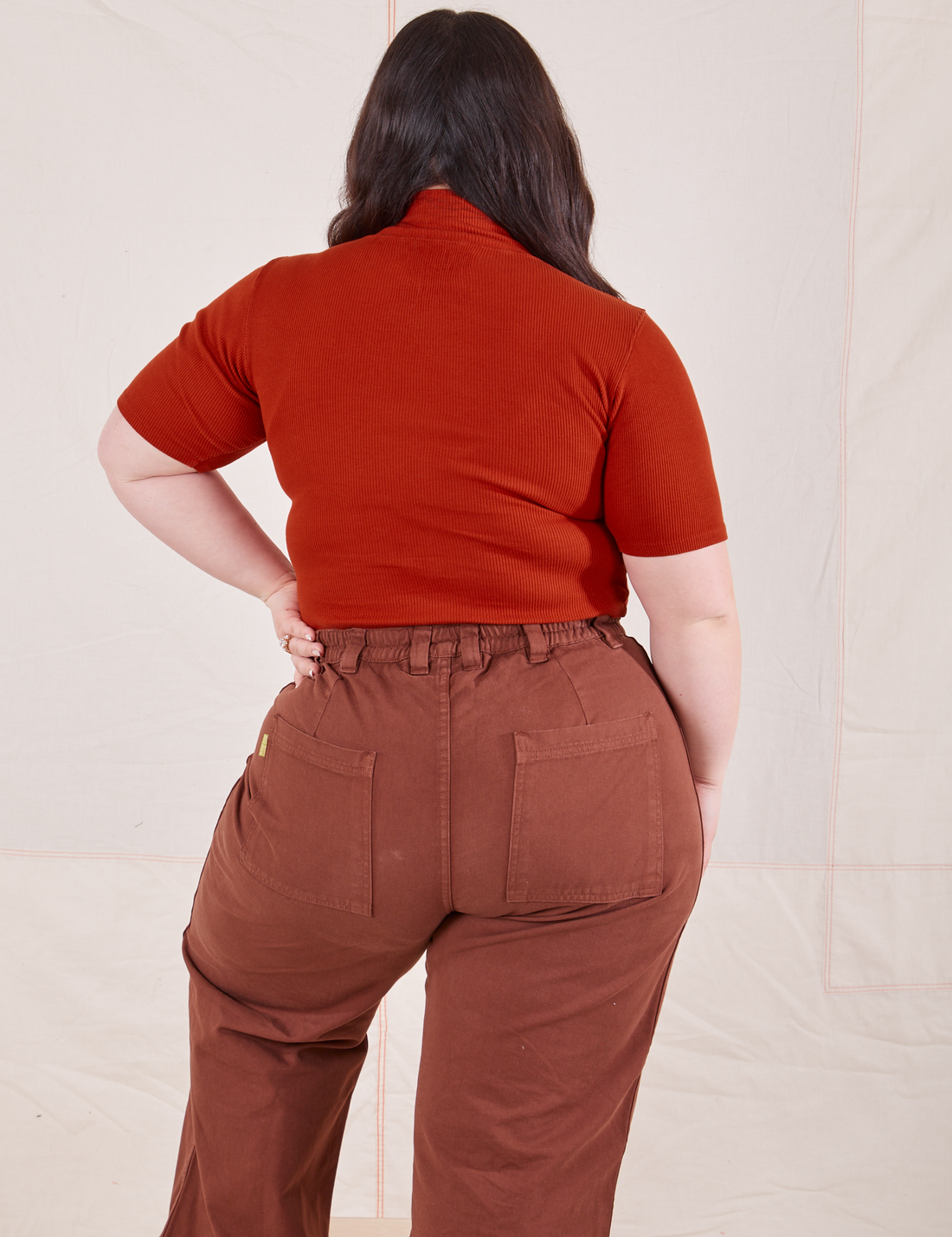 1/2 Sleeve Essential Turtleneck in Paprika back view on Ashley wearing fudgesicle brown Bell Bottoms