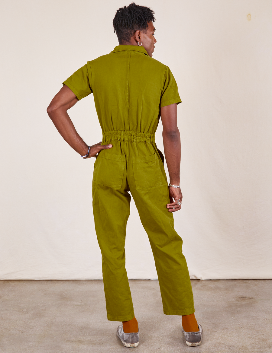 Back view of Short Sleeve Jumpsuit in Olive Green worn by Jerrod