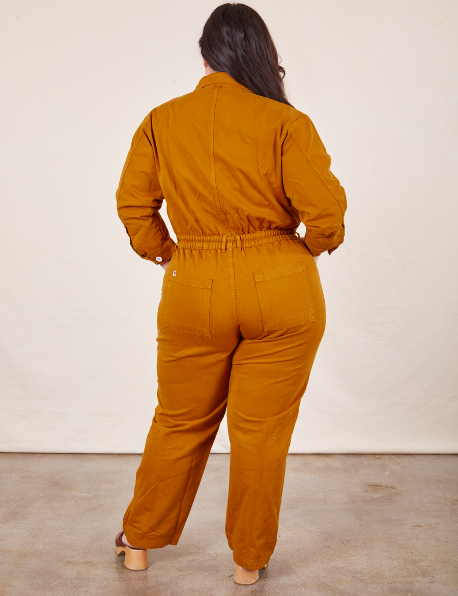 Back view of Everyday Jumpsuit in Spicy Mustard worn by Ashley