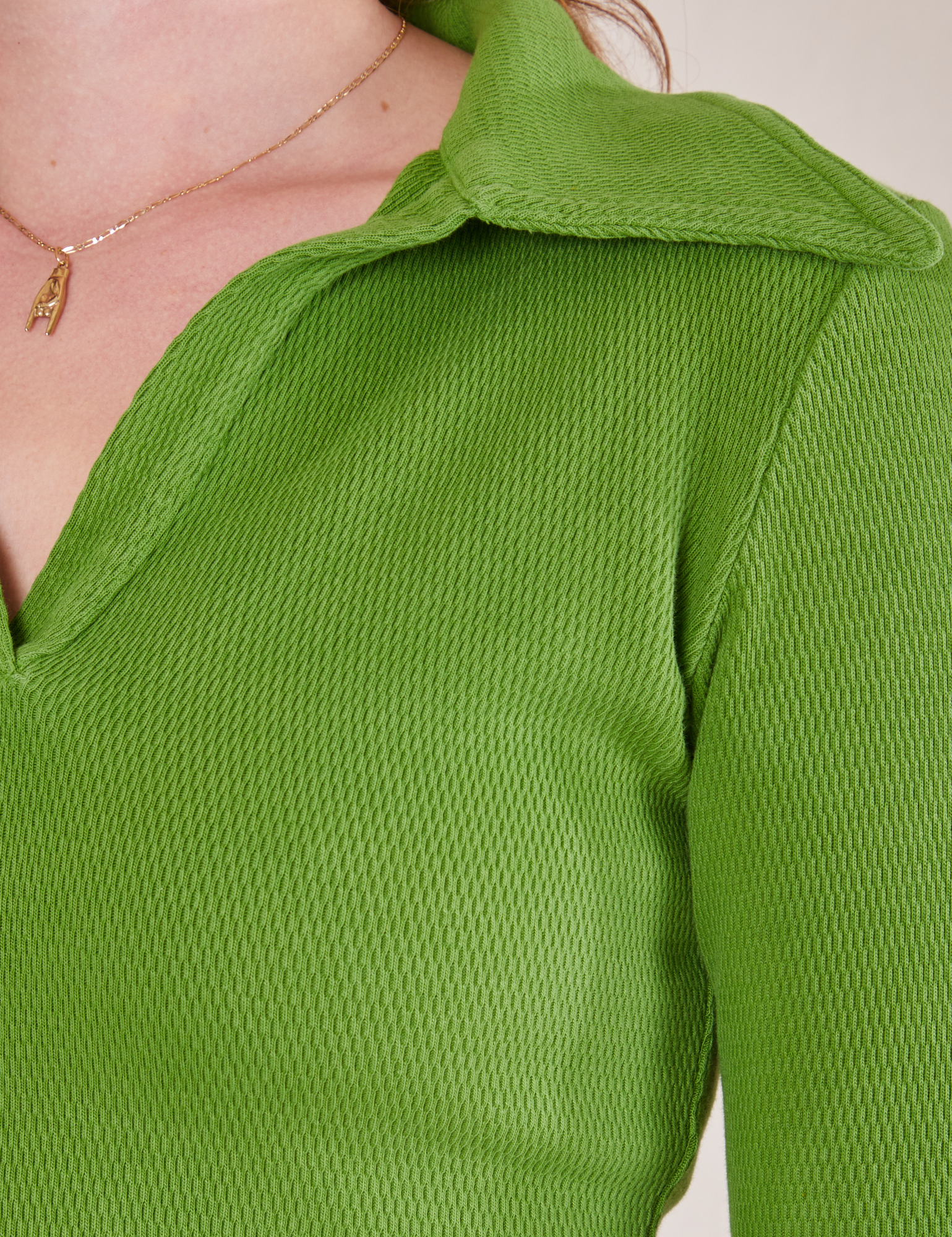 Front close up of Long Sleeve Fisherman Polo in Bright Olive worn by Alex