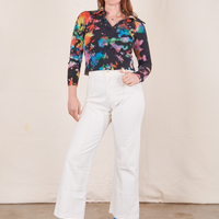 Allison is wearing Rainbow Magic Waters Long Sleeve Fisherman Polo and vintage off-white Western Pants