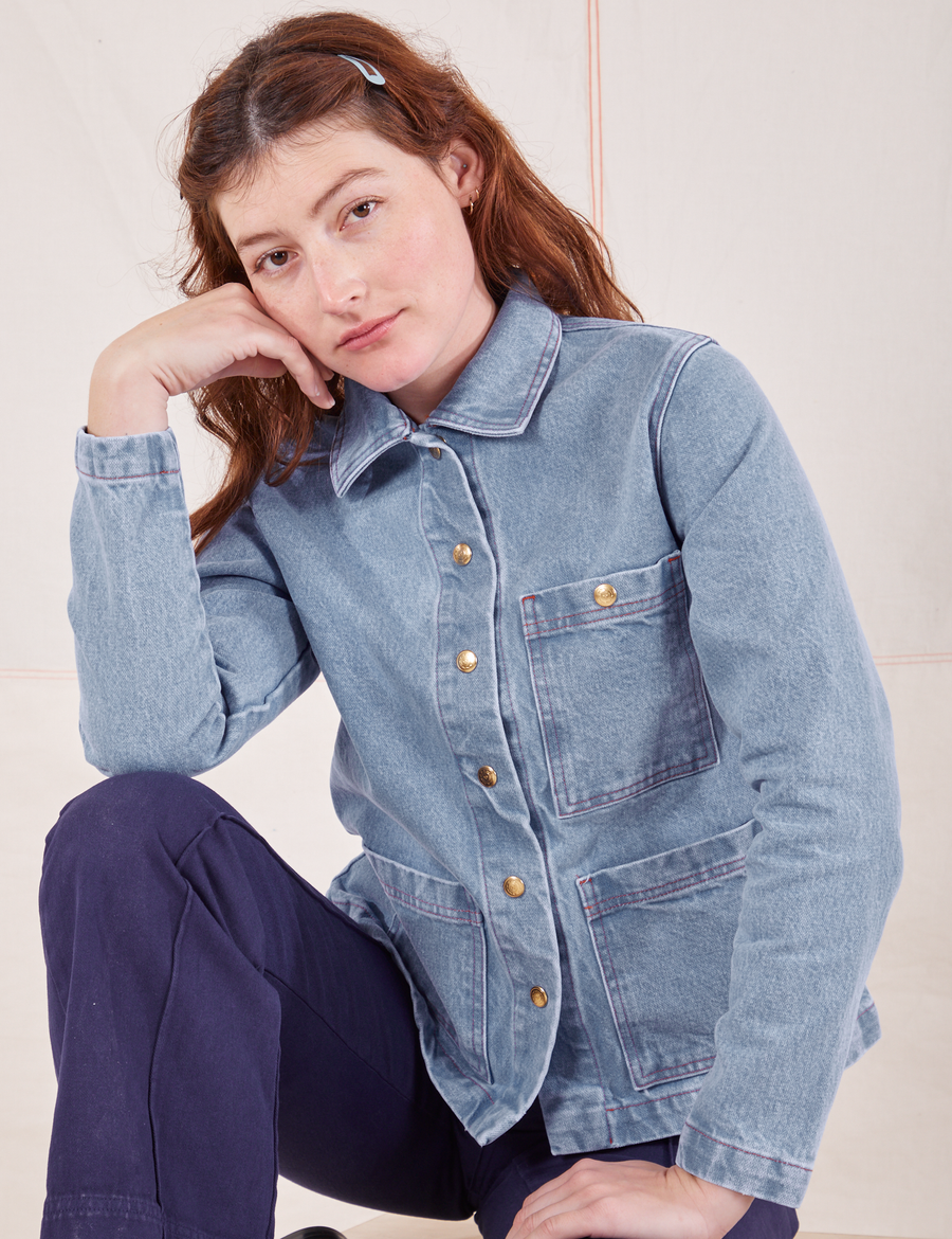Alex is wearing Indigo Denim Work Jacket in Light Wash