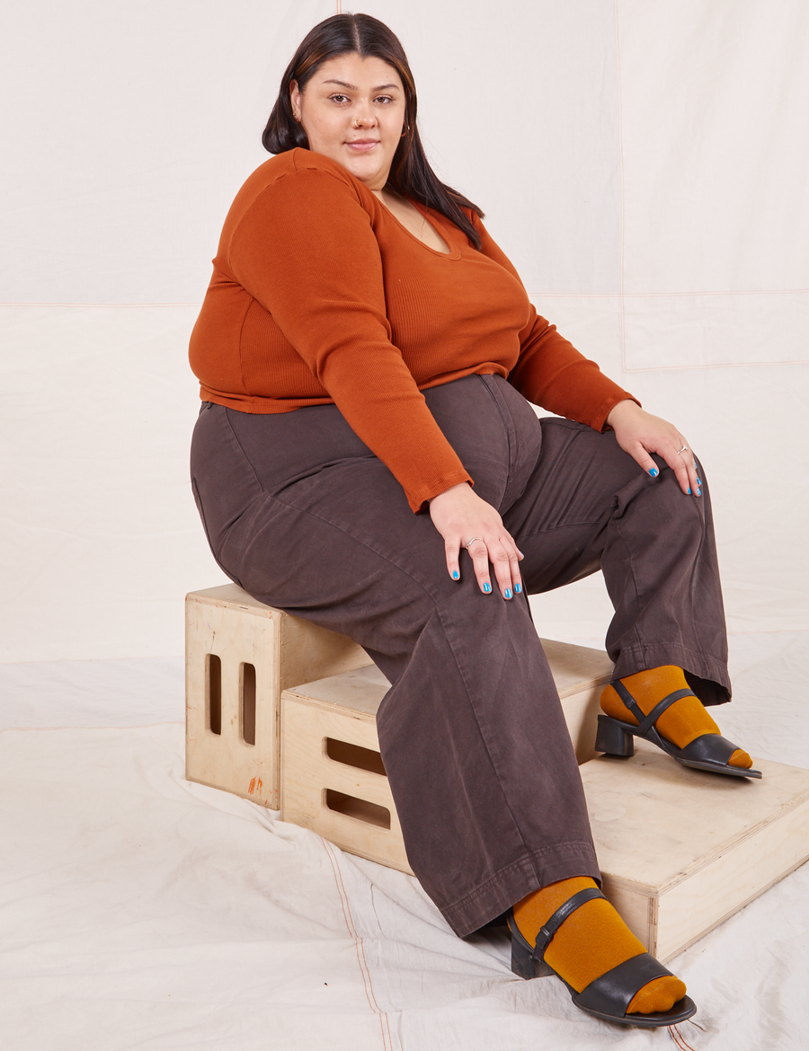 Sarita is wearing size 2XL Long Sleeve V-Neck Tee in Burnt Terracotta