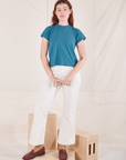 Alex is wearing P Organic Vintage Tee in Marine Blue paired with vintage off-white Western Pants