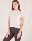 Alex is wearing Organic Vintage Tee in Sunshine Yellow and espresso brown Western Pants