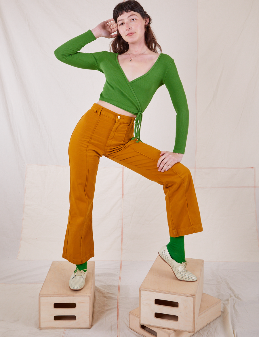 Wrap Top in Bright Olive on Alex wearing Spicy Mustard Western Pants
