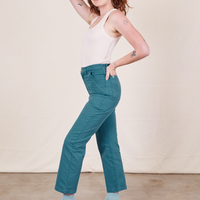 Work Pants in Marine Blue side view on Alex wearing vintage off-white Tank Top