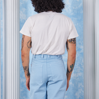 Peach Airbrush Organic Tee back view on Jesse wearing baby blue Bell Bottoms