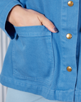 Neoclassical Work Jacket in Blue Venus front pocket close up with Tiara's hand inside