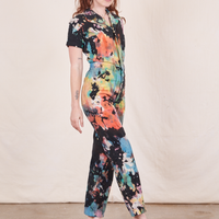 Short Sleeve Jumpsuit in Rainbow Magic Waters side view on Alex