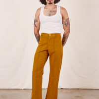 Western Pants in Spicy Mustard on Jesse wearing vintage off-white Tank Top