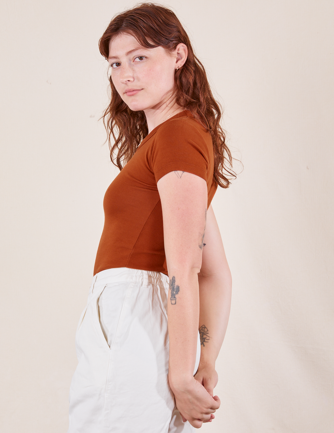 Side view of Baby Tee in Burnt Terracotta on Alex