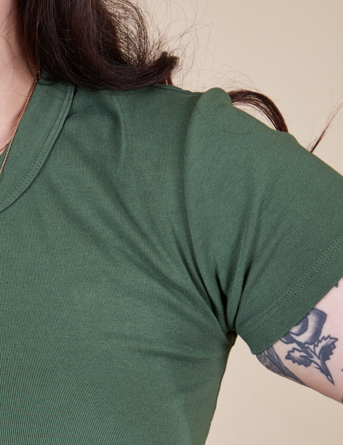 Front shoulder close up of Baby Tee in Dark Emerald Green on Sydney