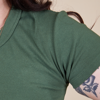 Front shoulder close up of Baby Tee in Dark Emerald Green on Sydney