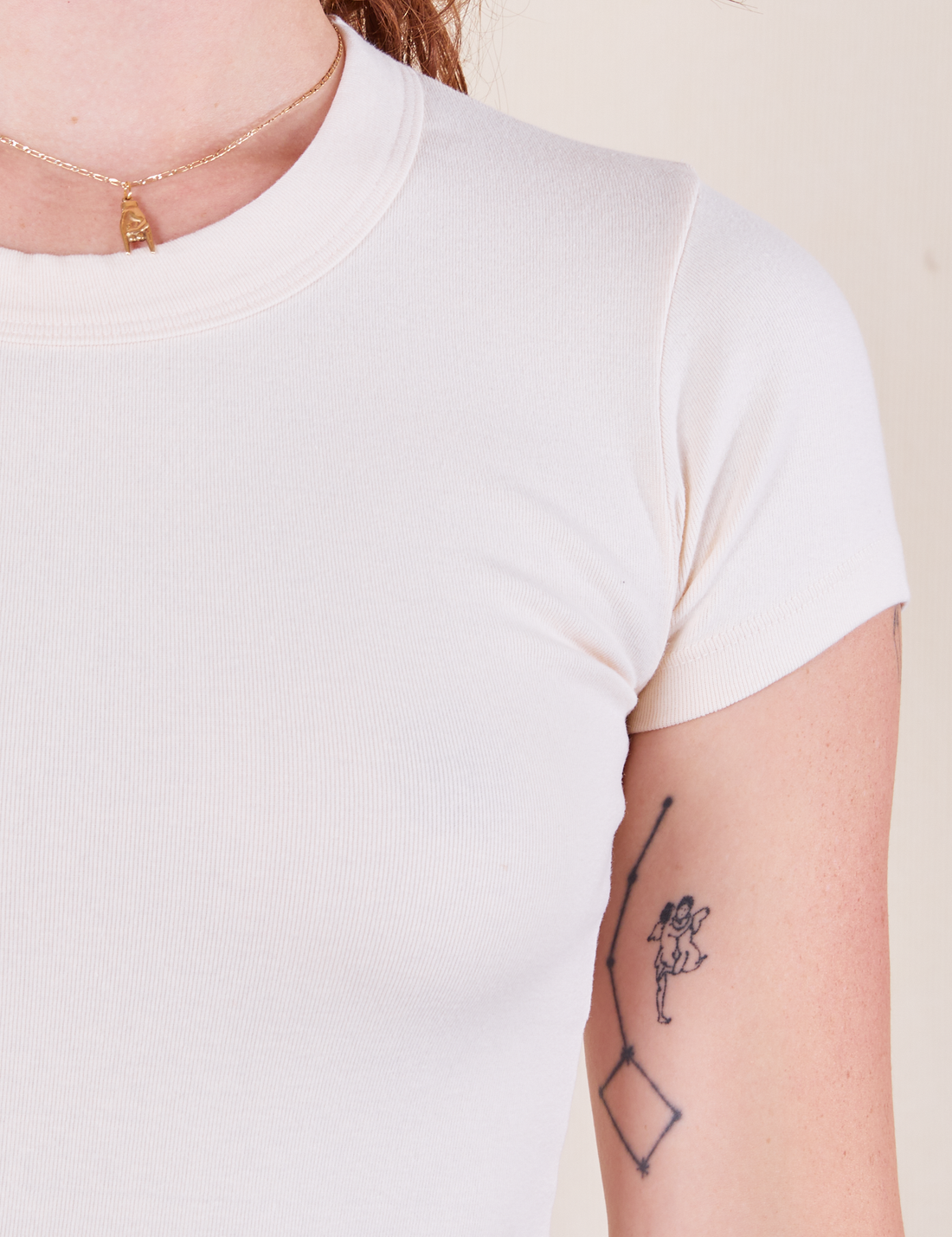 Front close up of Baby Tee in Vintage Tee White on Alex