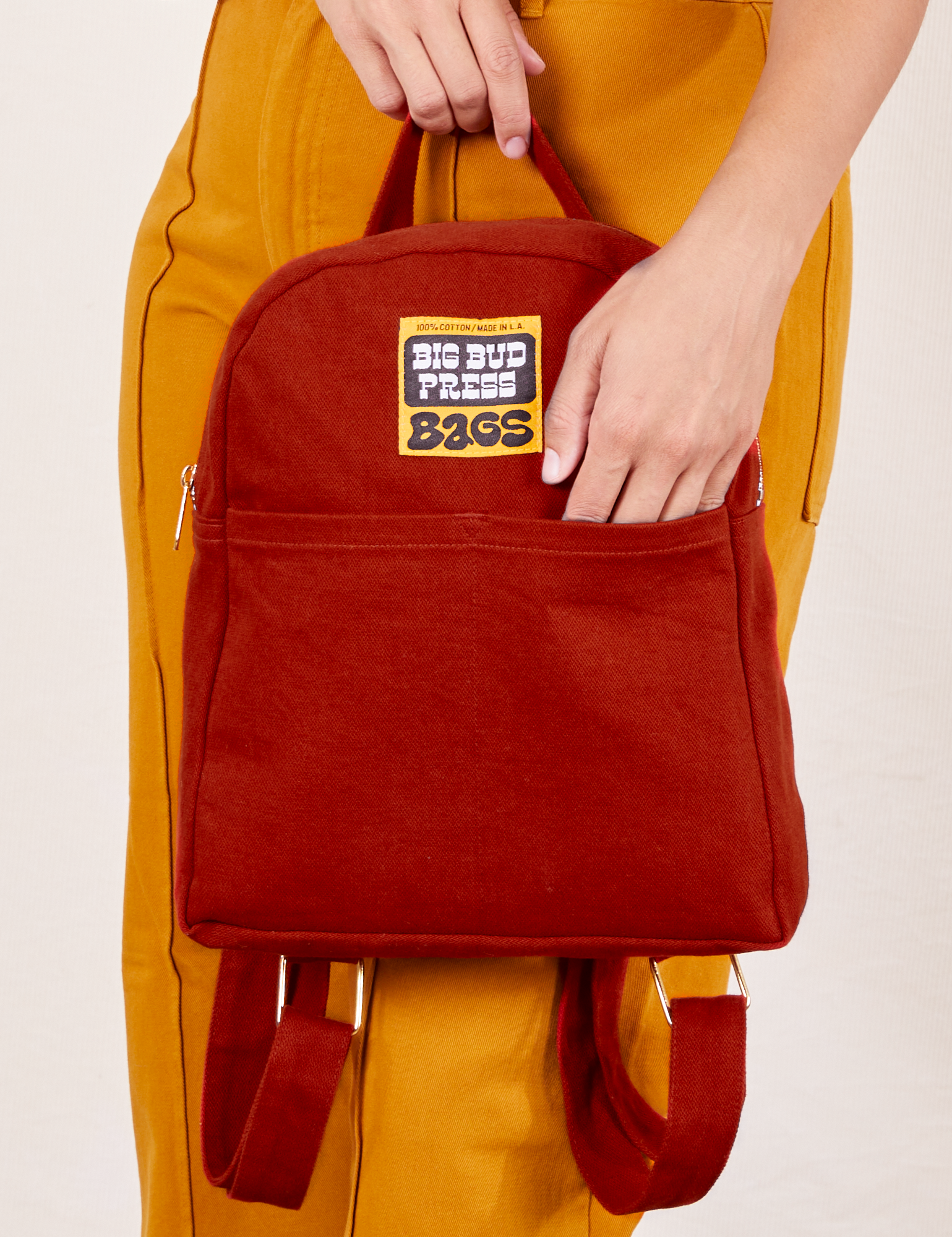 Mini Backpack in Paprika held by model