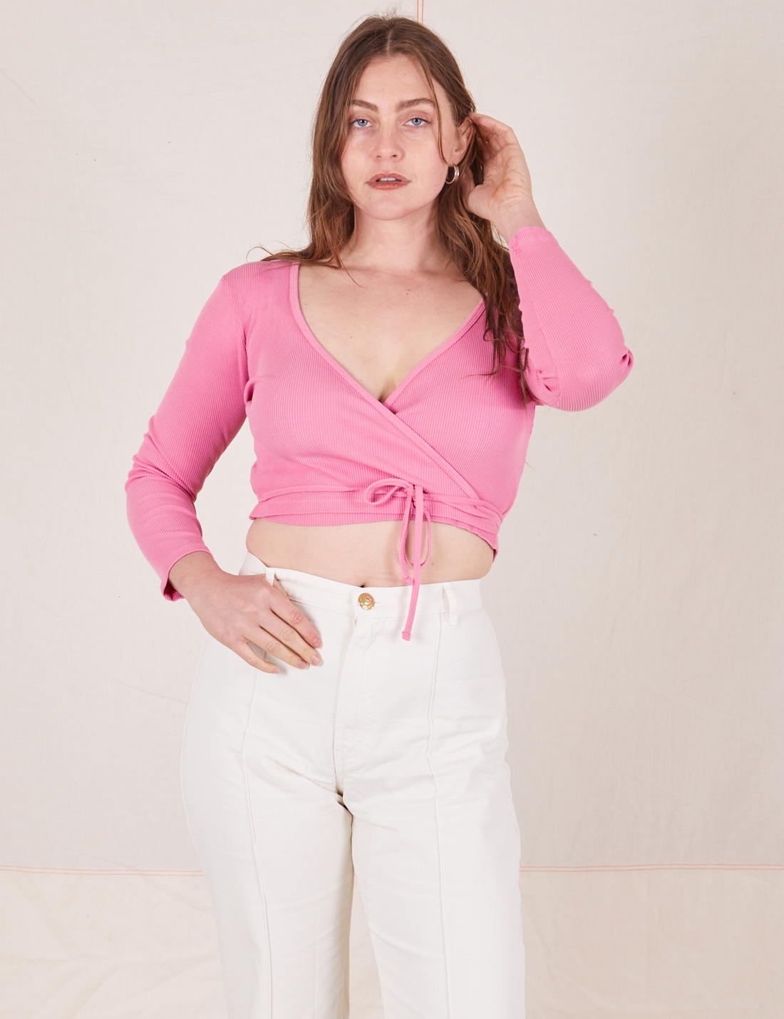Allison wearing size 1 Wrap Top in Bubblegum Pink paired with vintage off-white Western Pants