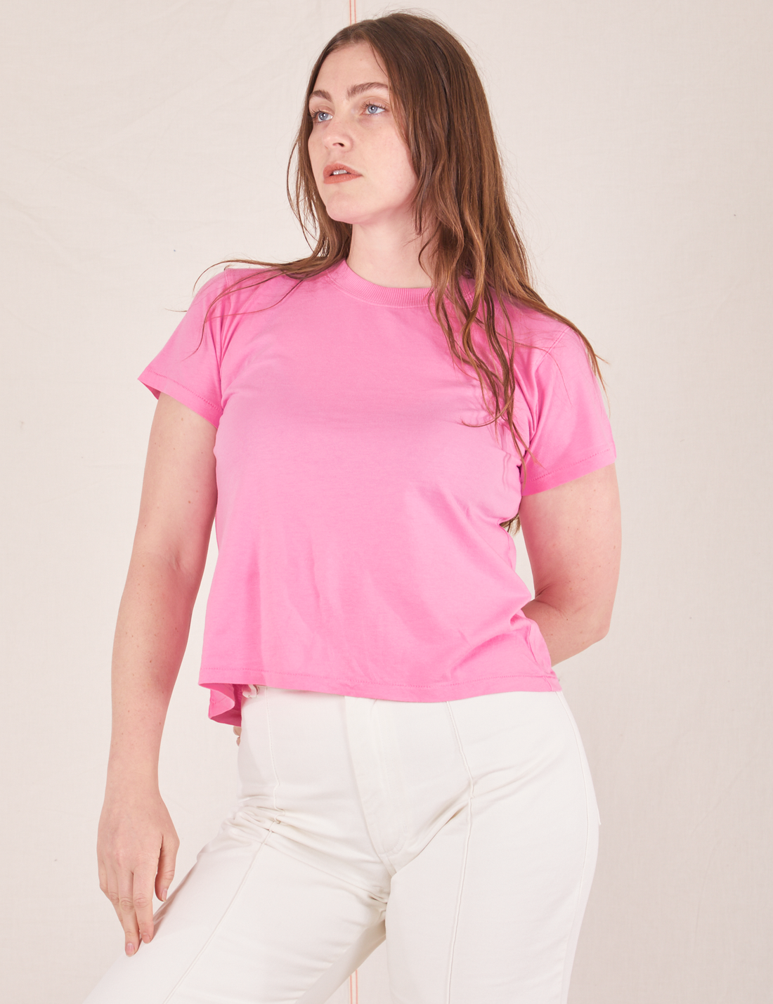 Allison is wearing XXS Organic Vintage Tee in Bubblegum Pink paired with vintage off-white Western Pants