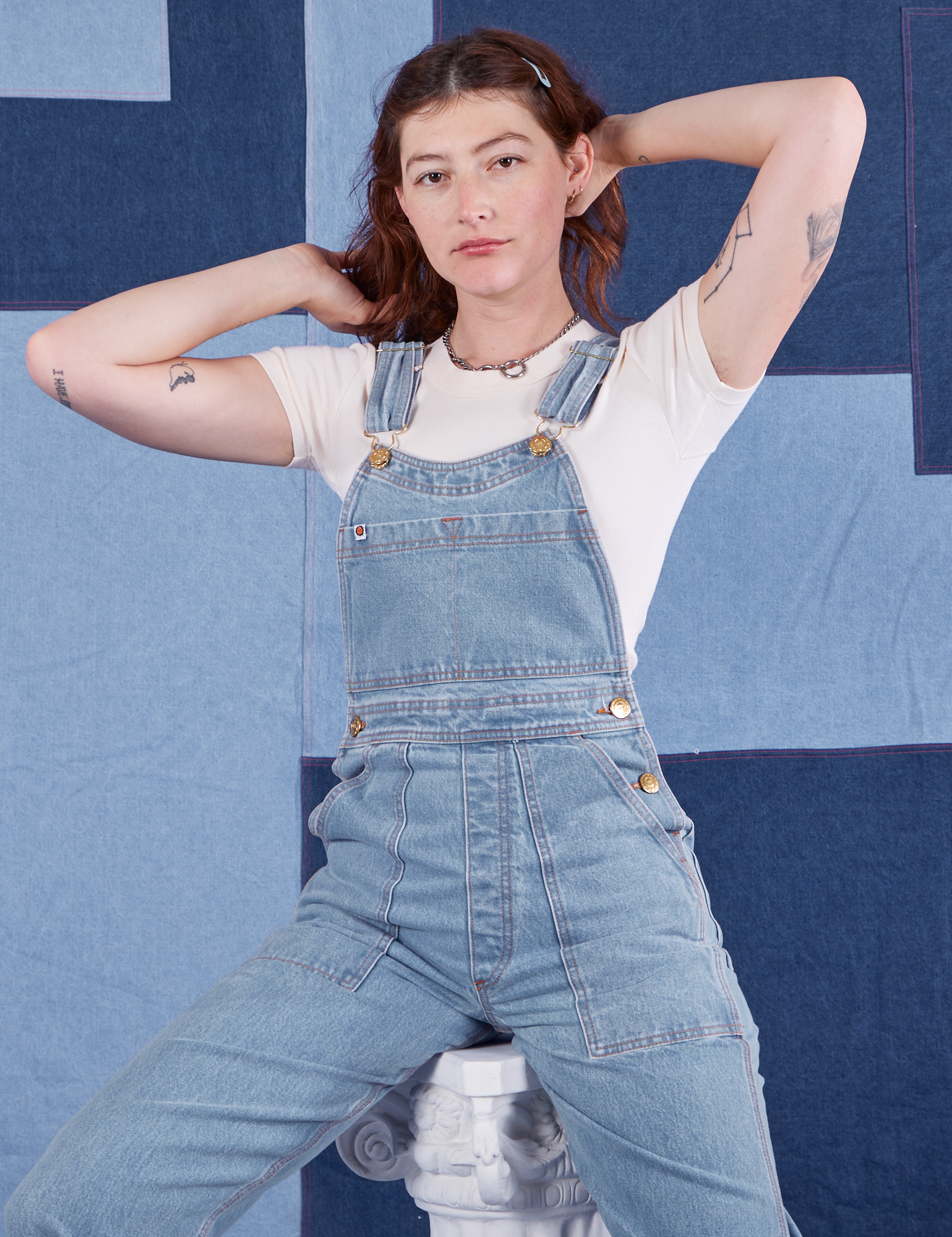 Indigo Denim Original Overalls in Light Wash on Alex wearing vintage off-white Baby Tee