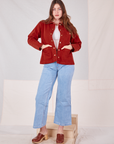 Allison is 5'10" and wearing XS Denim Work Jacket in Paprika paired with light wash Sailor Jeans