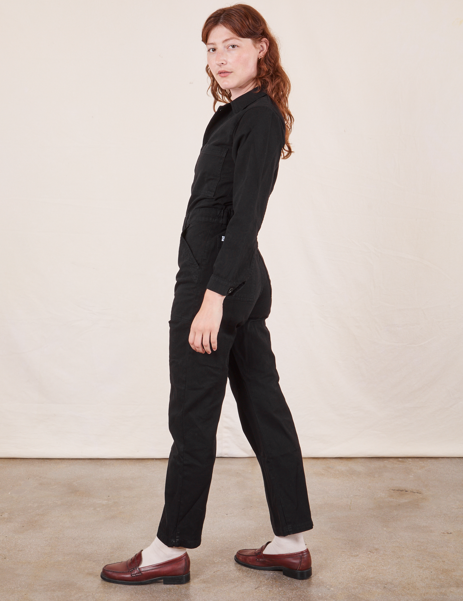 Side view of Everyday Jumpsuit in Basic Black worn by Alex