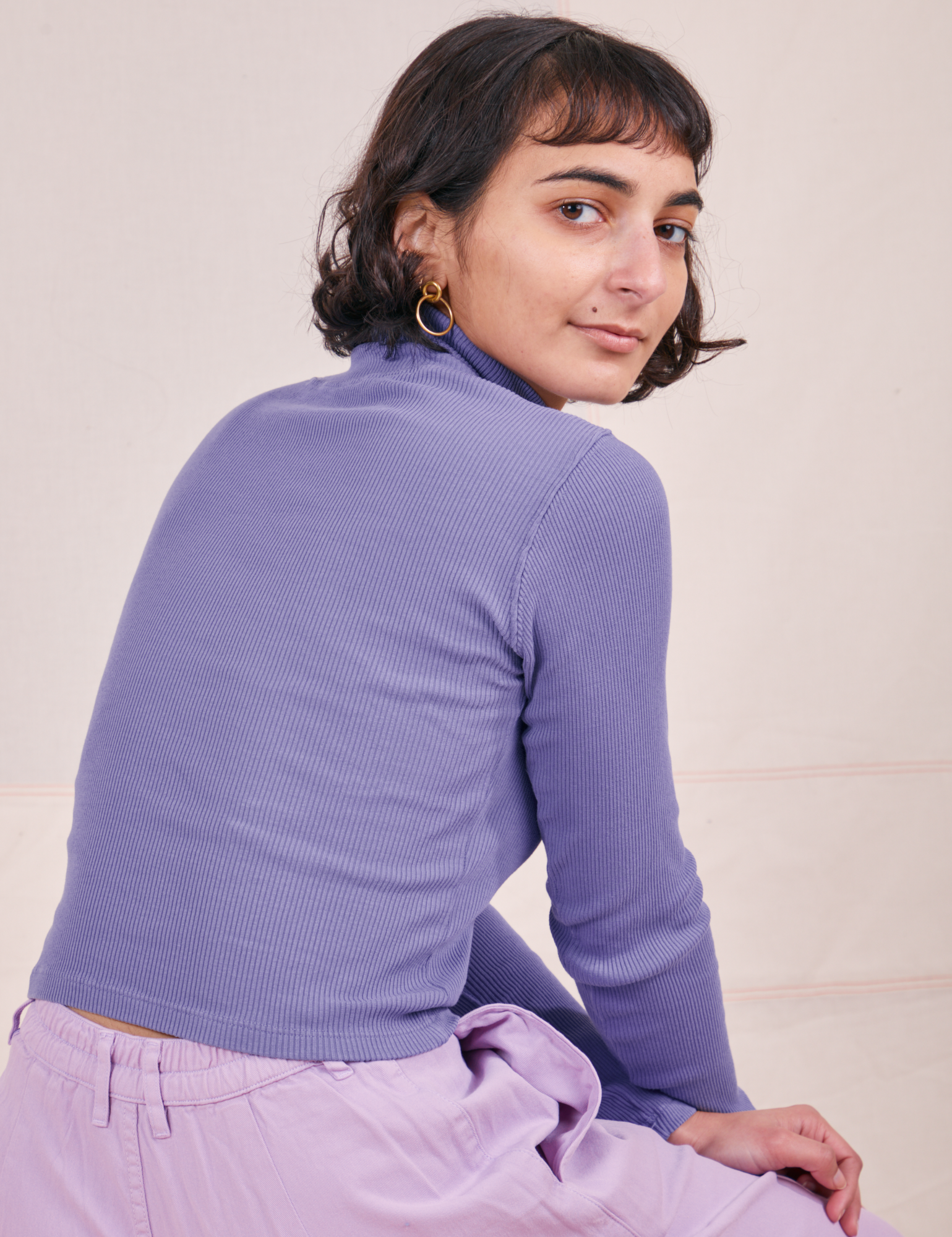 Back view of Essential Turtleneck in Faded Grape worn by Soraya