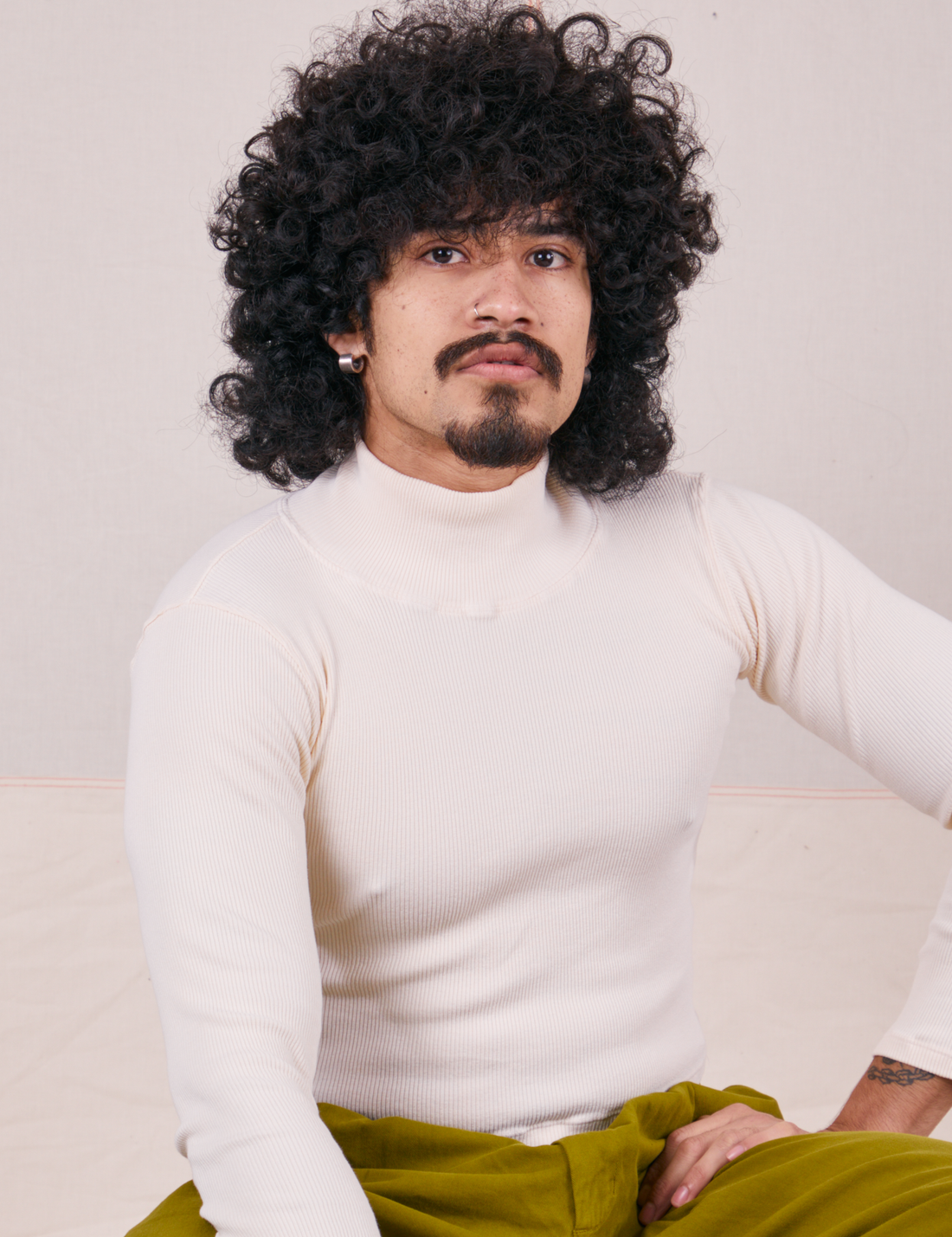 Jesse is wearing Essential Turtleneck in Vintage Off-White