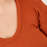 Long Sleeve V-Neck Tee in Burnt Terracotta neckline close up on Sarita
