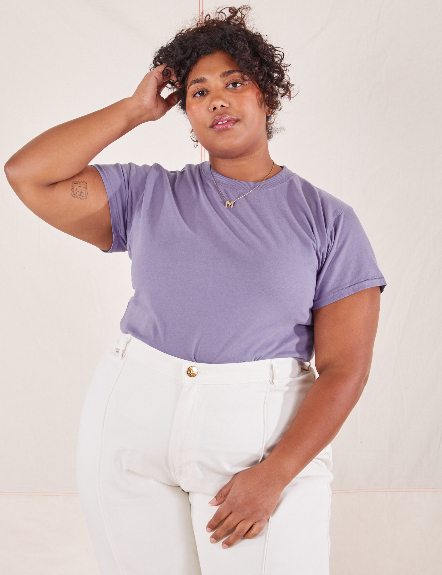 Morgan is wearing L Organic Vintage Tee in Faded Grape paired with vintage off-white Western Pants