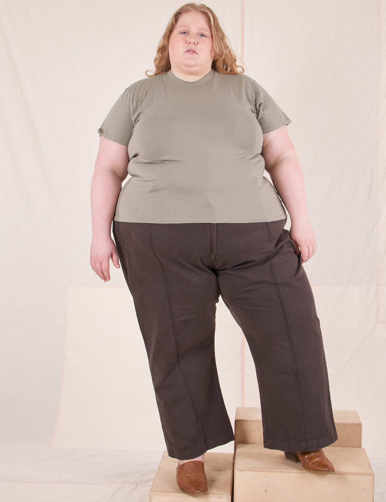 Catie is wearing 3XL Organic Vintage Tee in Khaki Grey paired with espresso brown Western Pants