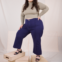 Ashley is wearing Essential Turtleneck in Khaki Grey and navy Western Pants