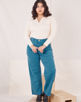 Melanie is 5'6" and wearing M Organic Work Pants in Marine Blue paired with vintage off-white Long Sleeve Fisherman Polo