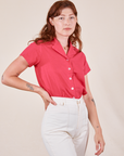 Alex is wearing Pantry Button-Up in Hot Pink tucked into vintage off-white Western Pants
