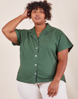 Morgan is wearing 1XL Pantry Button-Up in Dark Emerald Green