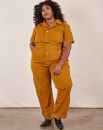 Morgan is 5'5" and wearing 2XL Short Sleeve Jumpsuit in Spicy Mustard