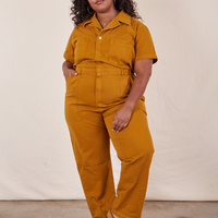 Morgan is 5'5" and wearing 2XL Short Sleeve Jumpsuit in Spicy Mustard