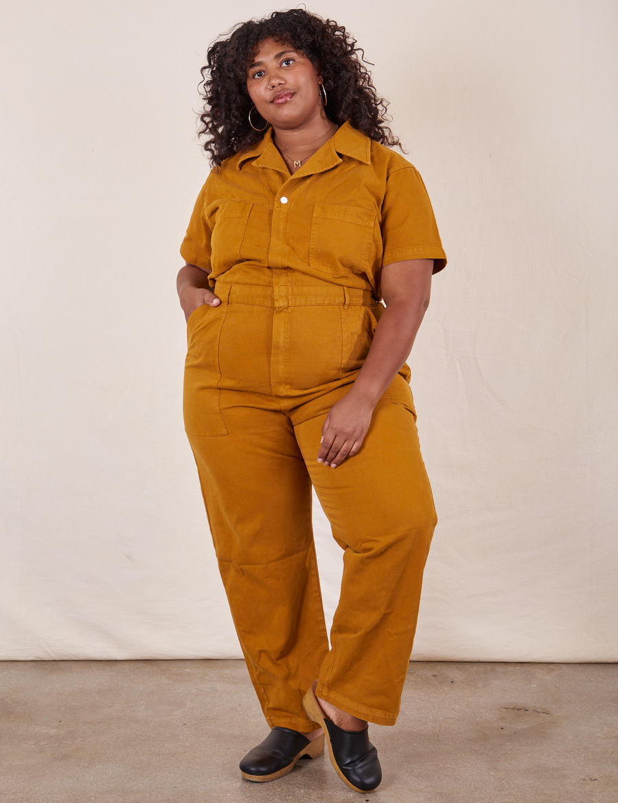 Morgan is 5'5" and wearing 2XL Short Sleeve Jumpsuit in Spicy Mustard