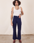 Jesse is 5'8" and wearing XS Western Pants in Navy Blue paired with vintage off-white Tank Top