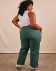 Back view of Work Pants in Dark Emerald Green and vintage off-white Tank Top