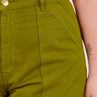 Work Pants in Olive Green front pocket close up on Faye