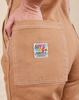 Original Overalls in Tan back pocket close up with artist togs label